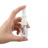 Clear 10 mL nasal spray pump bottle held by hand, white background